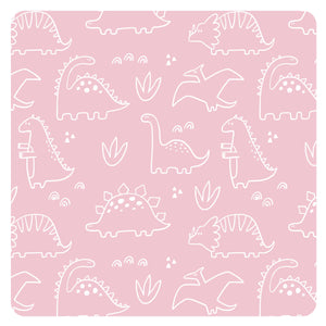 Blush Dino Friends Bapron for babies, angled view showcasing playful dinosaur design and practical bib features.