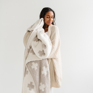 Cozy DOUBLE-LAYER BAMBONI® throw blankets for babies, perfect for swaddling and keeping warm.