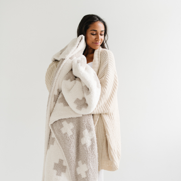 Cozy DOUBLE-LAYER BAMBONI® throw blankets for babies, perfect for swaddling and keeping warm.