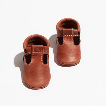 Moab T-Bar Baby Shoe in soft leather, perfect for little feet, featuring a secure strap and stylish design.