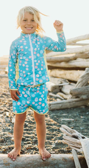 Jo-Jo Rash Guard in Sand Dollar design, angle view showcasing stylish and protective swimwear for babies.