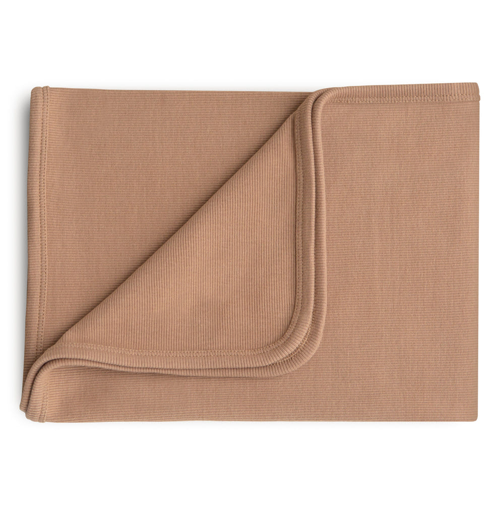 Soft ribbed baby blanket in soothing colors, perfect for keeping your little one cozy and warm.