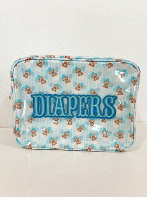 XL Diapers in a clear coat travel bag, angled view showcasing convenience and portability for parents on the go.