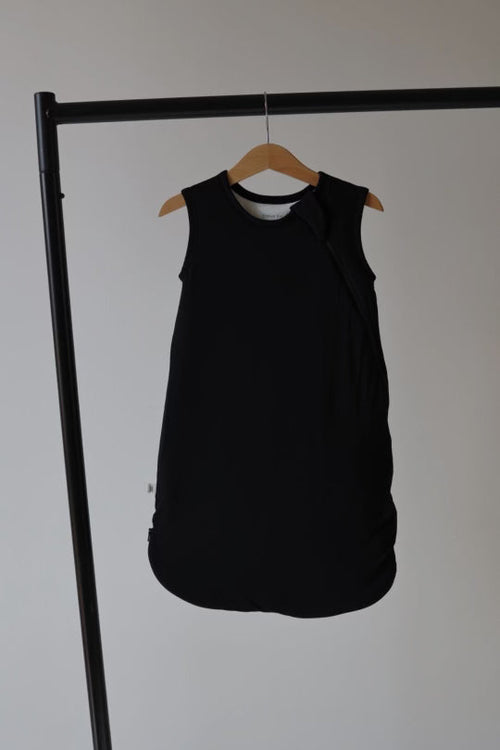 Bamboo Sleep Sack in Midnight Black, soft and cozy swaddle for babies, angle view showcasing design and fabric.