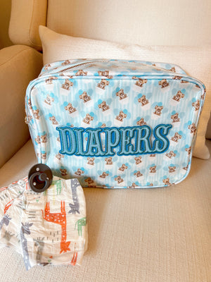 XL Diapers in Clear Coat Bag - Travel Bag for easy storage and portability, shown from angle 4.