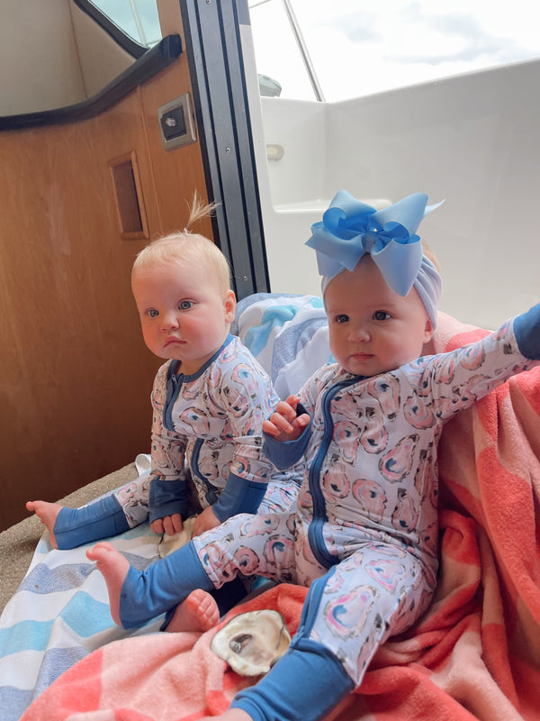 Blue Oysters Bamboo Sleeper pajamas for babies, shown at a 15-degree angle. Soft, breathable, and stylish sleepwear.