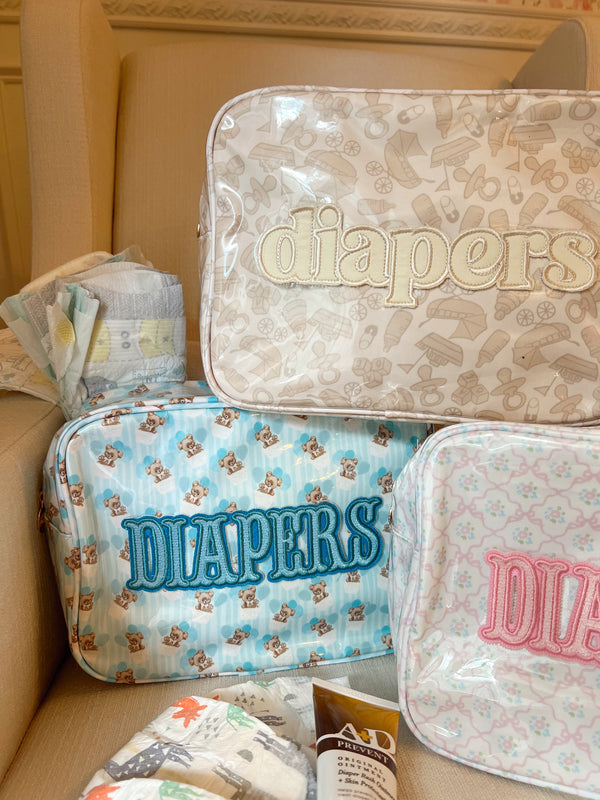 XL Diapers in a clear coat travel bag, showcasing convenience and portability for parents on the go.