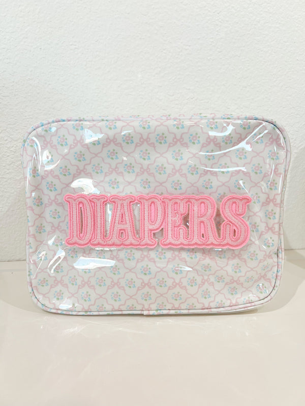 XL Diapers in a clear coat travel bag, showcasing convenience and portability for parents on the go.