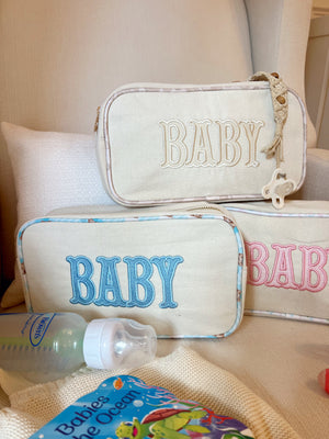 Large canvas travel bag for babies, angled view showcasing spacious design and stylish features.