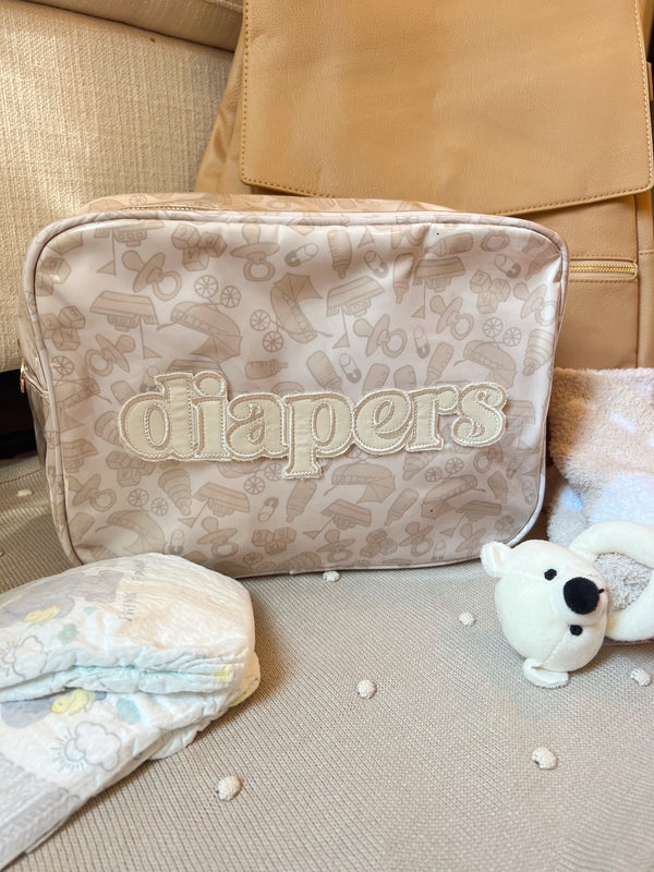 XL Diapers in a clear coat travel bag, angled view showcasing convenience and portability for parents on the go.
