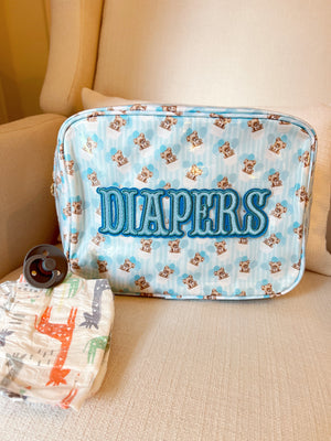 XL Diapers in a clear coat travel bag, angled view showcasing convenience and portability for parents on the go.