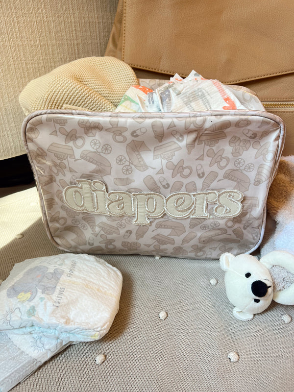 XL Diapers in a Clear Coat Travel Bag, angled view showcasing convenience and portability for parents on the go.