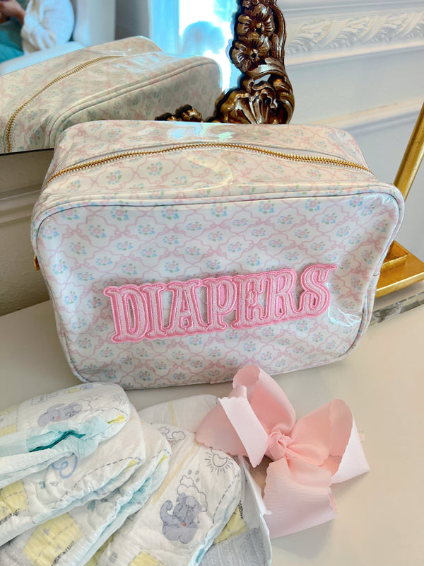 XL Diapers in a clear coat travel bag, angled view showcasing convenience and portability for parents on the go.