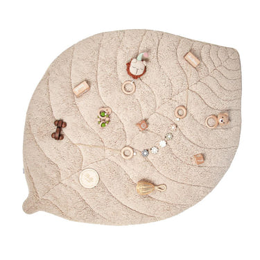 Leaf-shaped ivory sherpa and cotton baby playmat for comfortable playtime. Perfect for infants and toddlers.