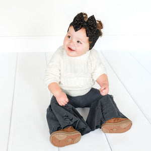 Distressed denim-inspired baby bell bottoms, stylish and comfy for little ones, shown from angle 4.