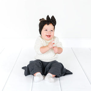 Distressed denim baby bell bottoms, stylish and comfy for little ones, showcased from angle 5.