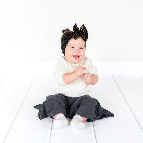 Distressed denim baby bell bottoms, stylish and comfy for little ones, showcased from angle 5.