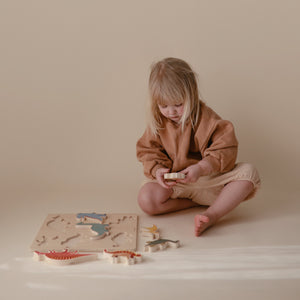 Colorful wooden dino puzzle at angle 5, perfect for toddlers' learning and playtime.