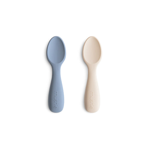 Silicone toddler starter spoons in vibrant colors for easy and safe feeding. Perfect for little hands.