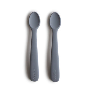 Silicone feeding spoons for babies, angled view showcasing soft, safe design for easy feeding.