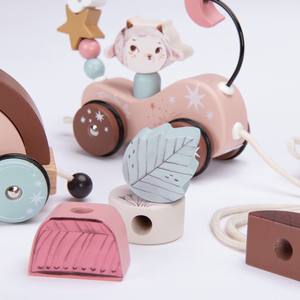 Pull along activity train from "After The Rain" collection, a charming wooden toy for toddlers.