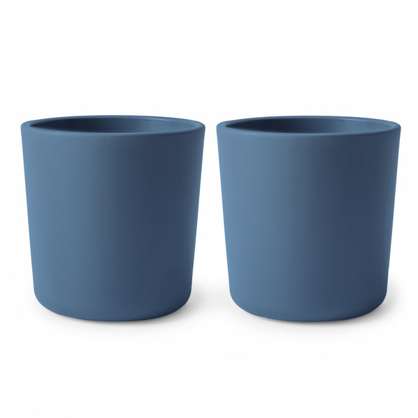 Colorful baby dinnerware cups in various sizes, angled view showcasing their playful design and safe materials.