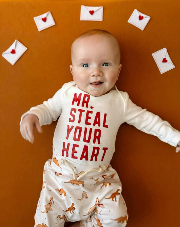 Valentine's Day Mr. Steal Your Heart Dino Jogger Outfit for babies, two-piece set, playful design, angle view.