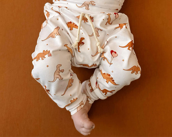 Valentine's Day Mr. Steal Your Heart Dino Jogger Outfit for babies, two-piece set, angle view.