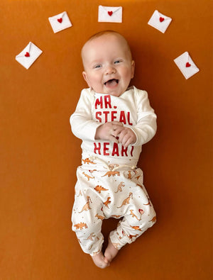 Valentine's Day Mr. Steal Your Heart Dino Jogger Outfit for babies, two-piece set, playful design, angle view.