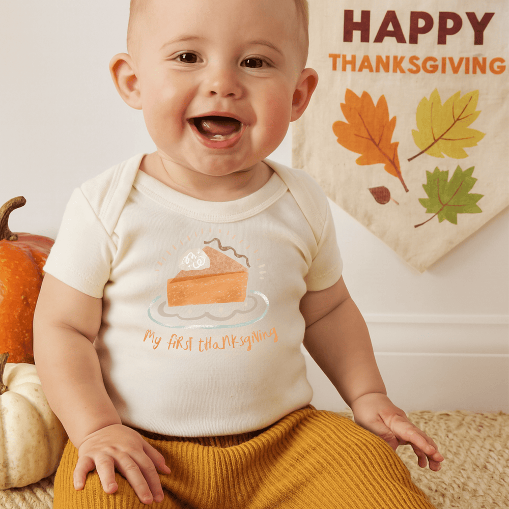 Thanksgiving pie graphic bodysuit for babies, short sleeve design, perfect for festive celebrations.