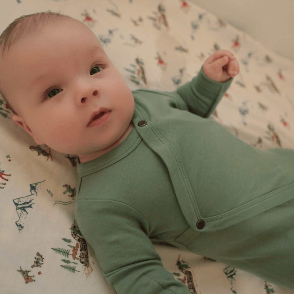 Basil Green baby footie one-piece, soft fabric, perfect for comfort and style.