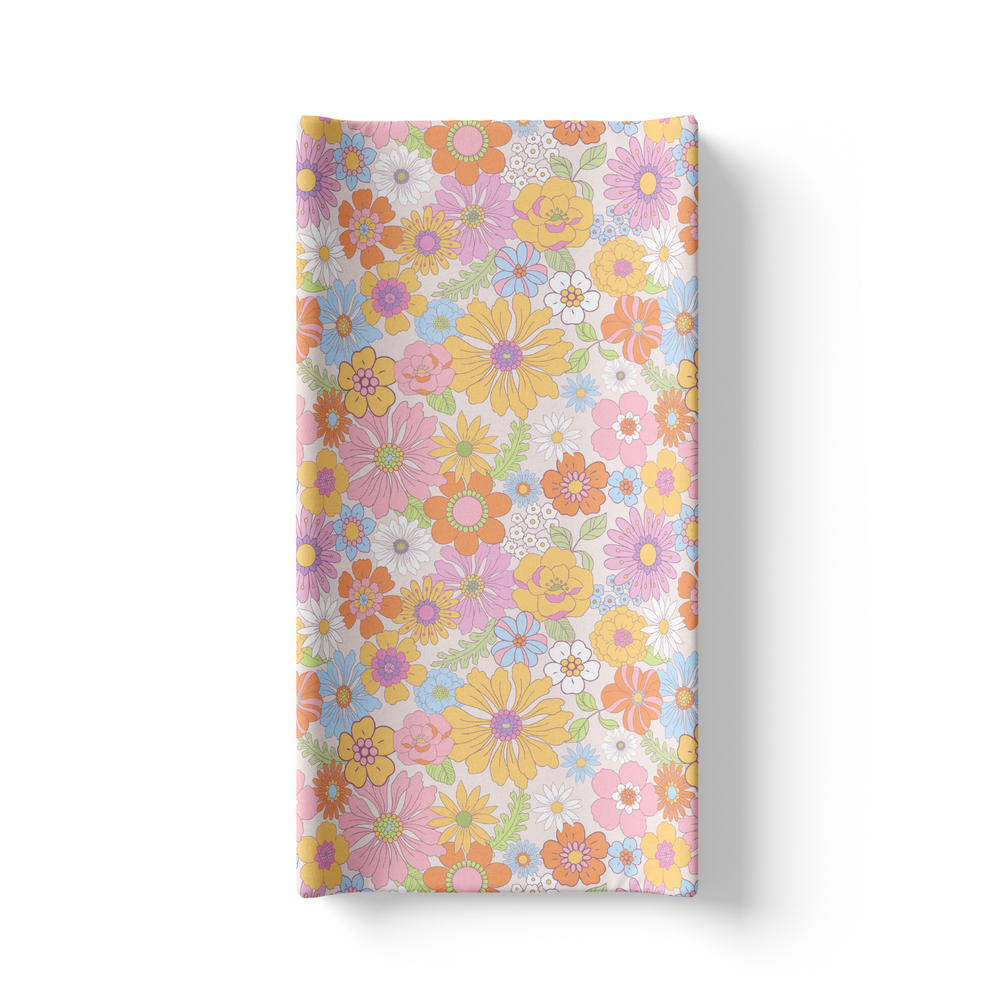 Retro floral changing pad cover for stylish and comfortable diaper changes. Perfect for nursery decor.