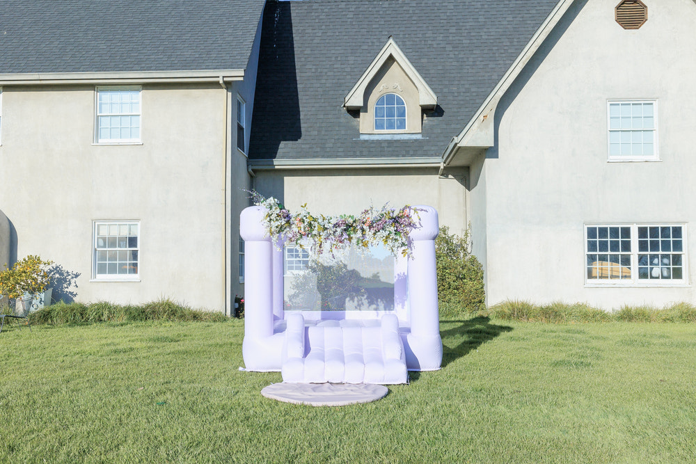 Mini Lila Pastel Purple Bounce House for outdoor playsets, perfect for kids' fun and active playtime.