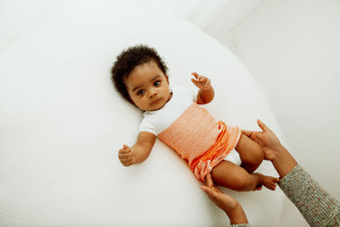 Orange Arms Out™ Short Sleeve Sleep Sack for babies, featuring a cozy design and bright orange color for comfortable sleep.