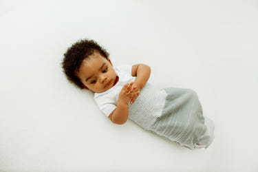 Grey Arms Out™ Short Sleeve Sleep Sack for babies, designed for comfort and safety during sleep.