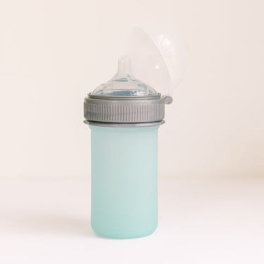 Silicone baby bottle in soft colors, perfect for safe feeding and easy grip for little hands.