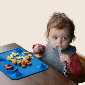 Colorful baby feeding utensils set at an angle, perfect for encouraging self-feeding in infants.