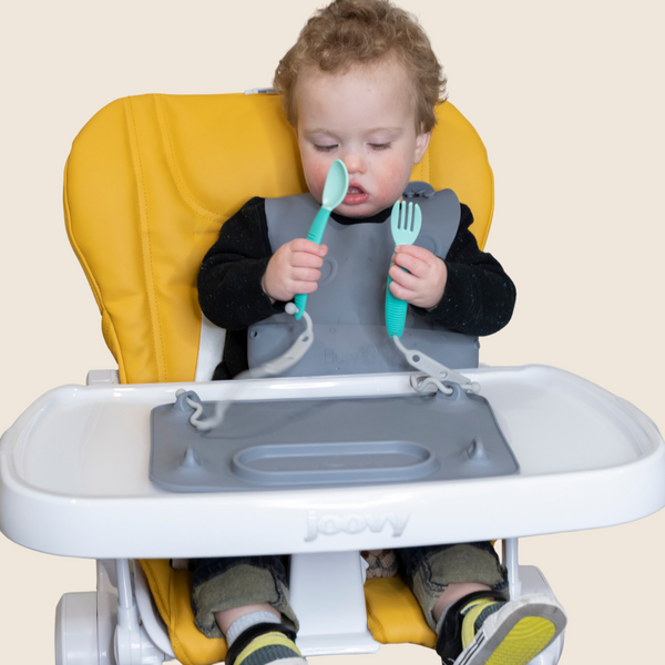 Colorful baby feeding utensils set, perfect for little hands, displayed at an angle for a clear view.