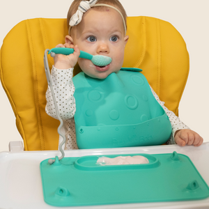 Colorful baby feeding utensils set, angled view showcasing spoons and forks for toddlers. Perfect for mealtime fun!