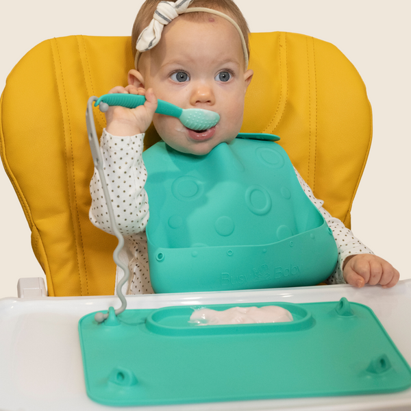Colorful baby feeding utensils set, angled view showcasing spoons and forks for toddlers. Perfect for mealtime fun!