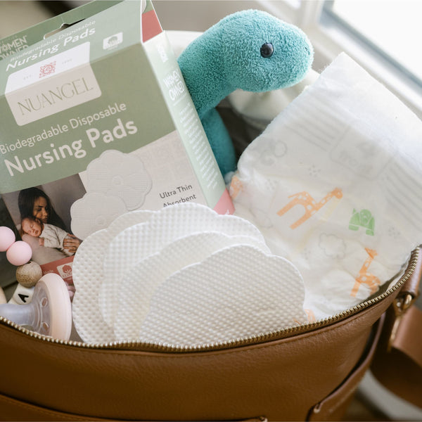 Plant-based disposable nursing pads in a natural setting, showcasing eco-friendly design and comfort for new mothers.