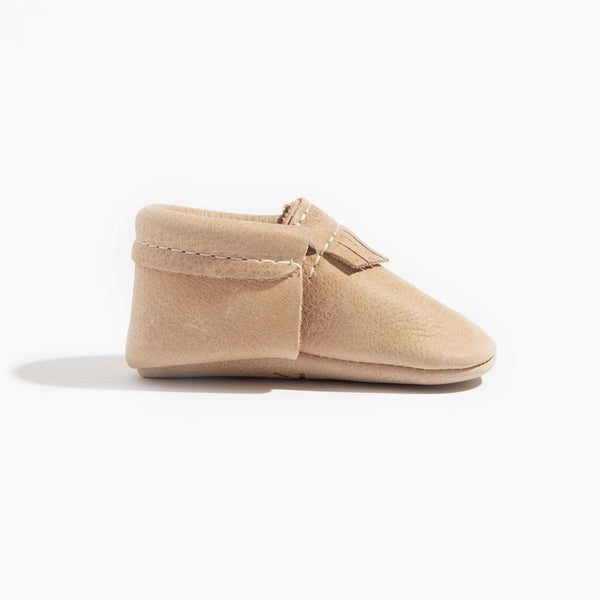 Weathered brown city baby shoe, angle 3 view, perfect for stylish little ones on the go.