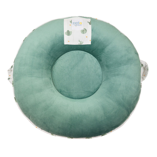 Wilder Sage Floor Cushion in a cozy setting, perfect for baby playtime and comfort. Angle view showcasing design.