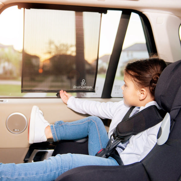 Primo Passi Roller Window Sun Shade for Car, 2Pk, Black - Baby stroller accessory, angle view.