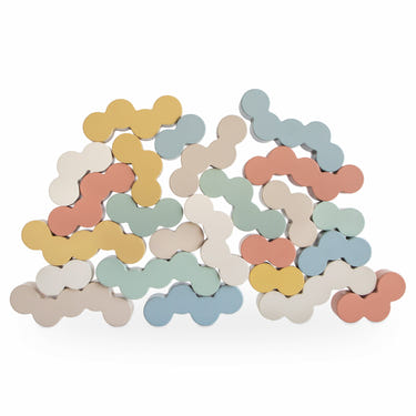 Colorful wooden balance blocks for toddlers, promoting motor skills and creativity in playtime.