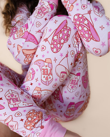 Bamboo two-piece cowgirl romper for babies, featuring a stylish and comfortable design.