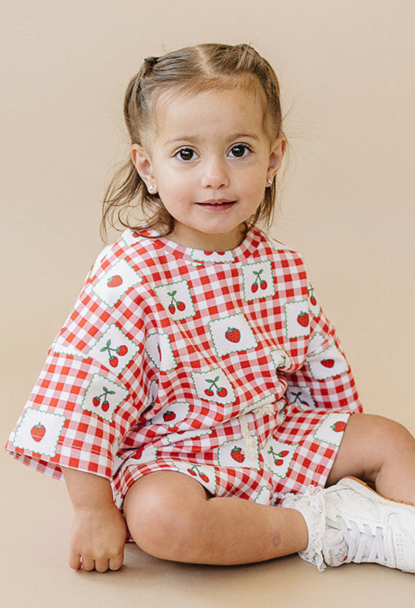 Baby shorts set in strawberry gingham, angle view 8, perfect for summer outings and playful adventures.