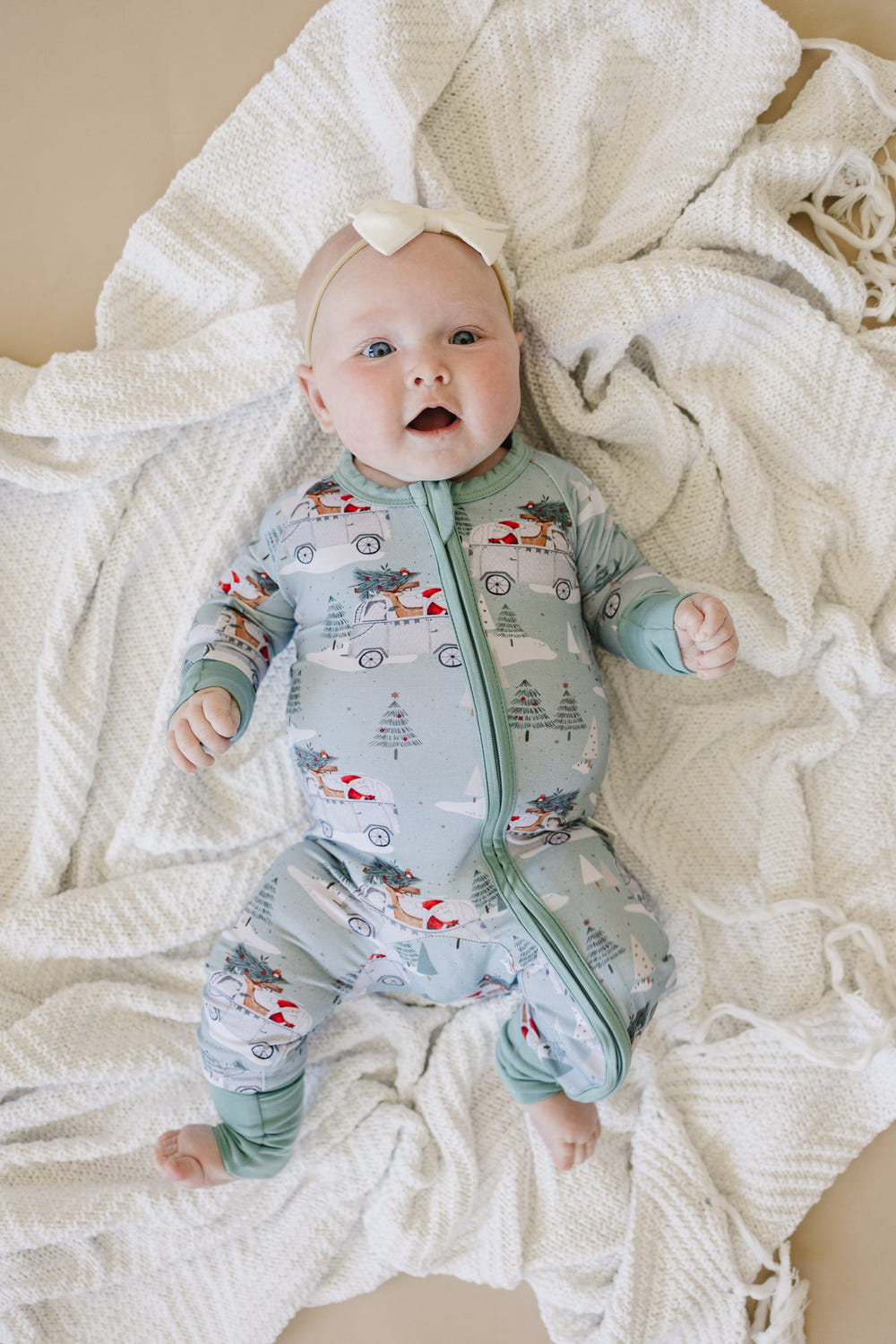 Cruisin' to Christmas Bamboo Zippy Romper for babies, featuring festive design and soft, breathable fabric.