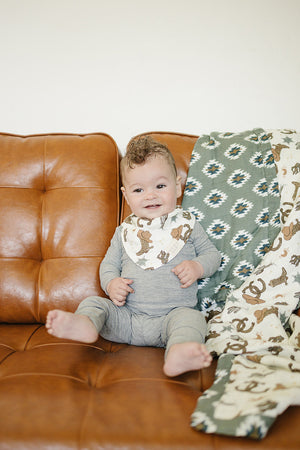 Outlaw Cowboy Classic Muslin Bib for babies, showcasing a stylish design from angle 2. Perfect for mealtime messes.