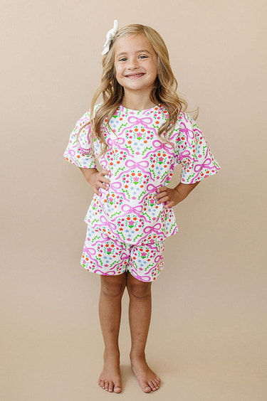 Coquette Garden baby shorts set in vibrant colors, perfect for warm weather and playful outings.